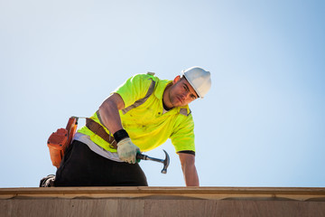 Man hammering nail