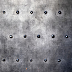 Black metal plate or armour texture with rivets