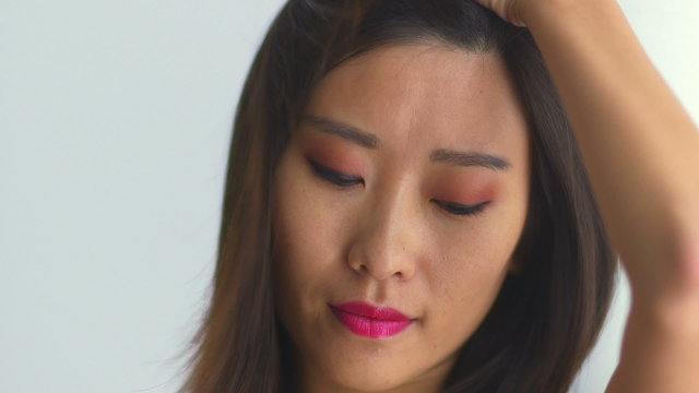 Closeup of sexy Chinese woman looking at camera