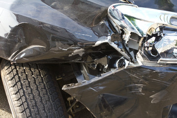 Above the headlights and wheels, flat tires deflated due .