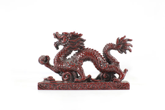 Dragon carving on white .