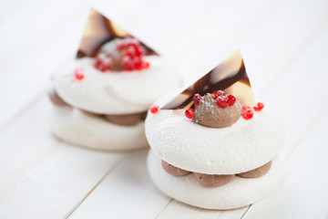 Fancy cakes on wooden boards, studio shot