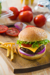 hamburger fast food with plenty of raw materials on the backgrou