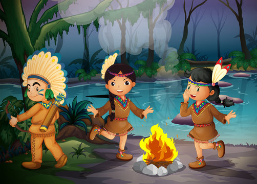 A forest with three young Indians