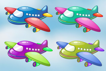 Quatre avions jouets dans le ciel