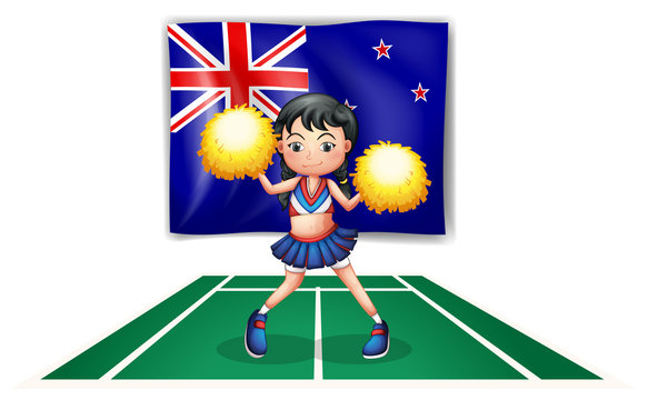 A cute cheerdancer in front of the New Zealand flag