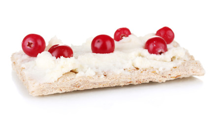 Crispbread with cheese and cranberry, isolated on white