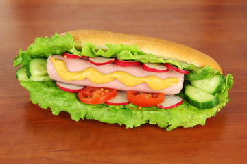 Tasty hot dog on table in cafe