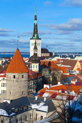 Old town of Tallinn. Houses with red roofs and church