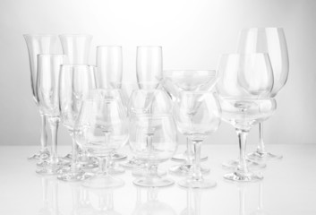 Cocktail and wine glasses, on gray background