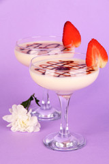 Fruit smoothies on lilac background