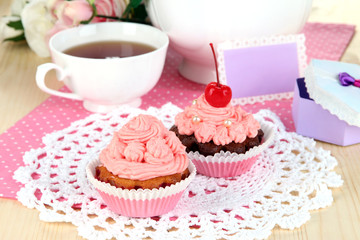 Beautiful strawberry cupcakes and flavored tea