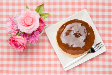 artificial rose and cheese cake