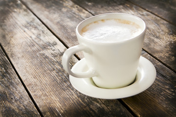 Delicious coffee cup with foam.