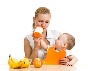 baby boy feeding mother