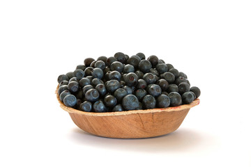 Bilberry in a bowl isolated on white