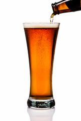 Pouring Amber Lager Into Pint Glass
