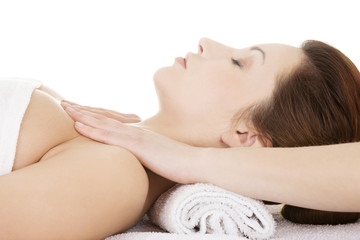 Fototapeta na wymiar Attractive woman relaxing beeing massaged