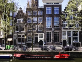 Fotobehang Passeggiando lungo i canali di Amsterdam © MyBionicEye