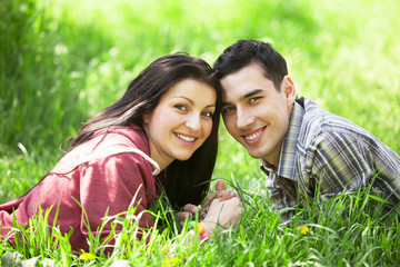 Couple Relaxing on Green grass