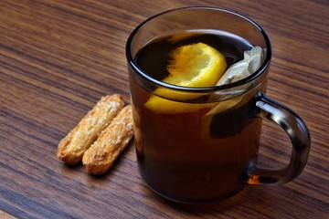 Tea with lemon and cookies in the office