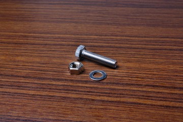 Stainless steel washer bolt nut on the table