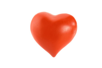 Red heart made of plasticine on a white background