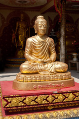 Golden statue of Buddha in meditation. Thailand