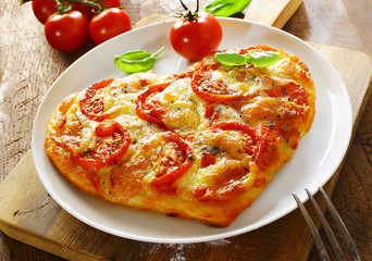 Delicious heart shaped Italian pizza
