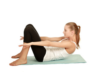 Young woman doing exercise isolated on white background