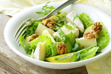 salad with pear, walnuts and cheese camembert