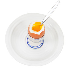 soft boiled egg in egg cup with spoon
