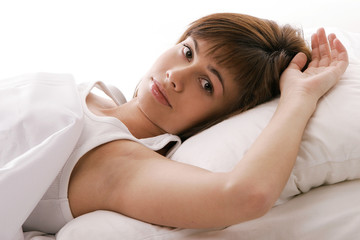 Fototapeta premium Girl thinking in bed