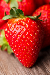 Close-up of strawberry on wooden table. 