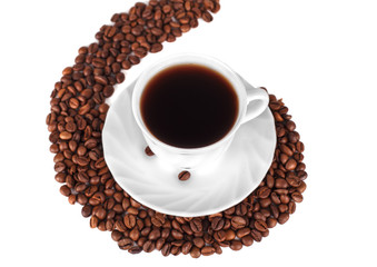 Coffee cup standing on a spiral of coffee beans.