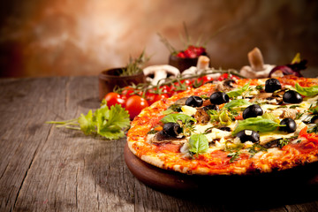 Delicious fresh pizza served on wooden table - obrazy, fototapety, plakaty