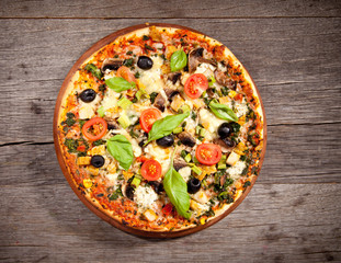 Delicious fresh pizza served on wooden table