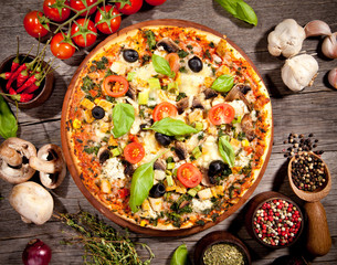 Delicious fresh pizza served on wooden table