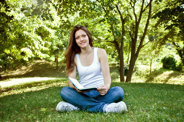 Woman with book in park