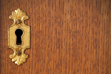 keyhole on wooden background