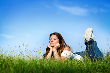 Young girl relaxing and listening music