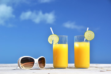 Sunglasses and orange juice