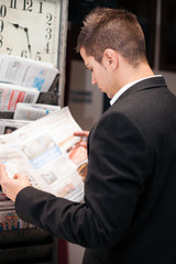 Fototapeta na wymiar Businessman reading newspaper