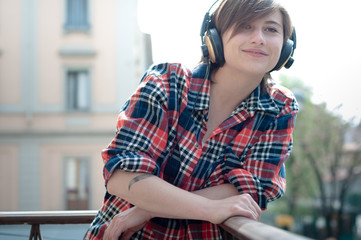 young hipster woman listening to music