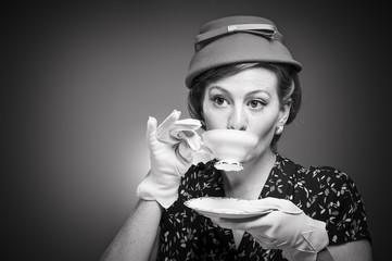 Retro Woman Drinking Her Tea - obrazy, fototapety, plakaty