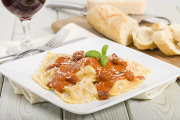 Ravioli filled with chicken & chorizo. Tomato & chorizo sauce.