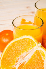 Glass of orange juice and fruits