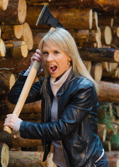 Young screaming pretty woman with big axe