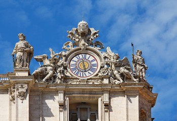Clock on facade of Saint Peter basilica. Vatican, Italy