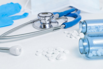 Close-up of a stethoscope and tablets